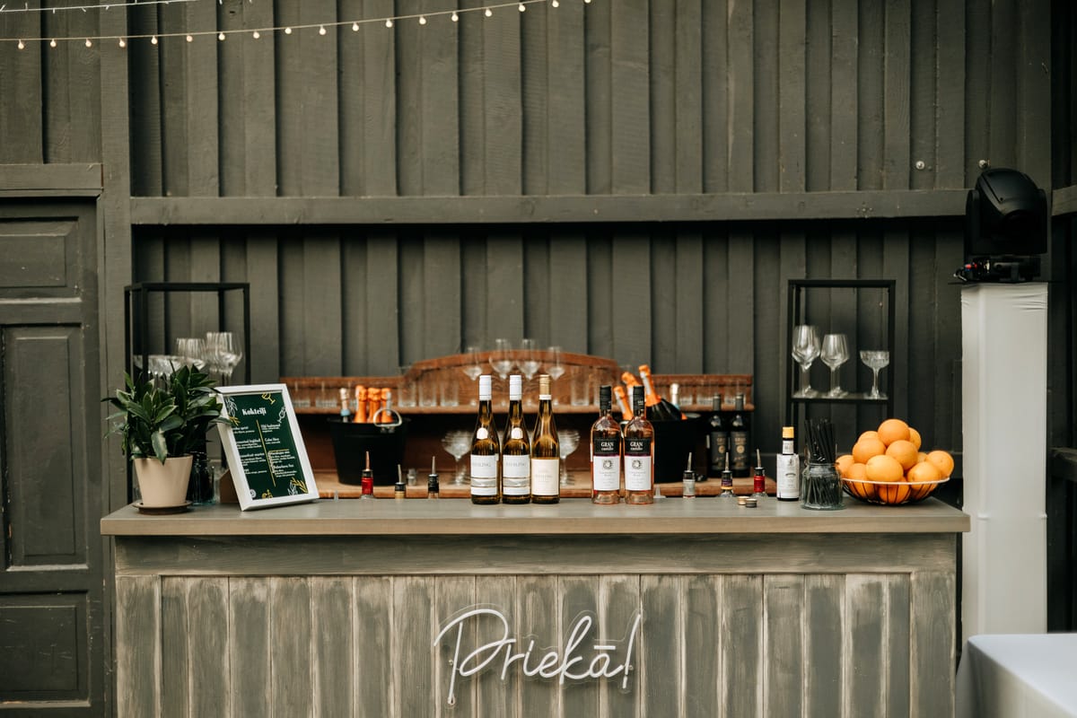 Barista engaging warmly with a guest in a coffee shop environment during service.